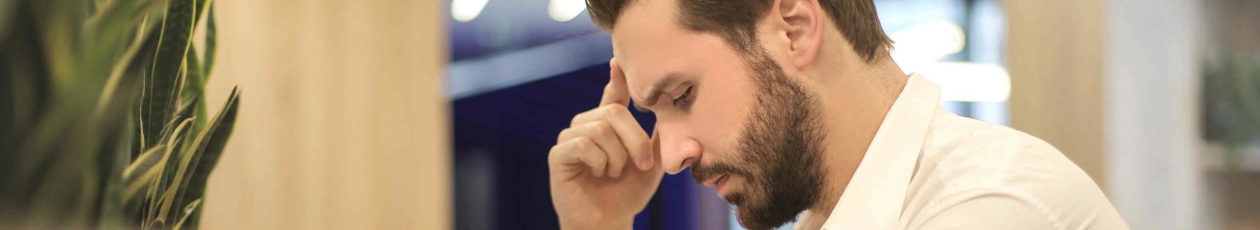 A man thinking about which debt he should prioritise